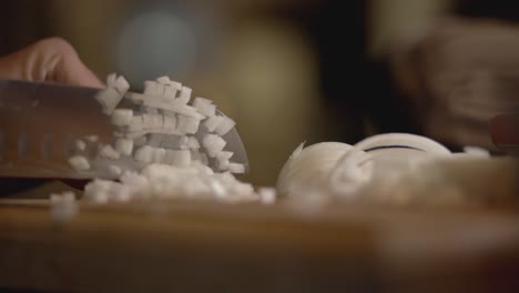 Chefs-Hand-CuttingWhite-Onions-Into-Smal-Cubes