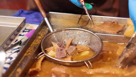 street vendor cooking traditional hong kong dish