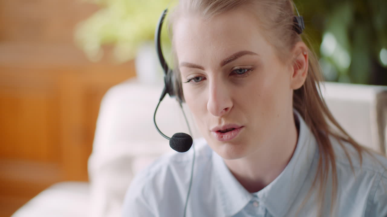 Sales Representative In Headset Speaking To Client And Making Video Conference Call On Laptop 7