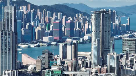 4k tele zoom view of hong kong central district - slow pan aerial view angle from sky.