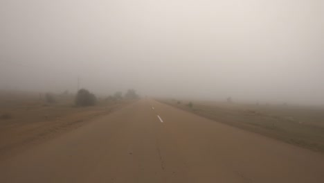 fog on a indian road. pov car trip.