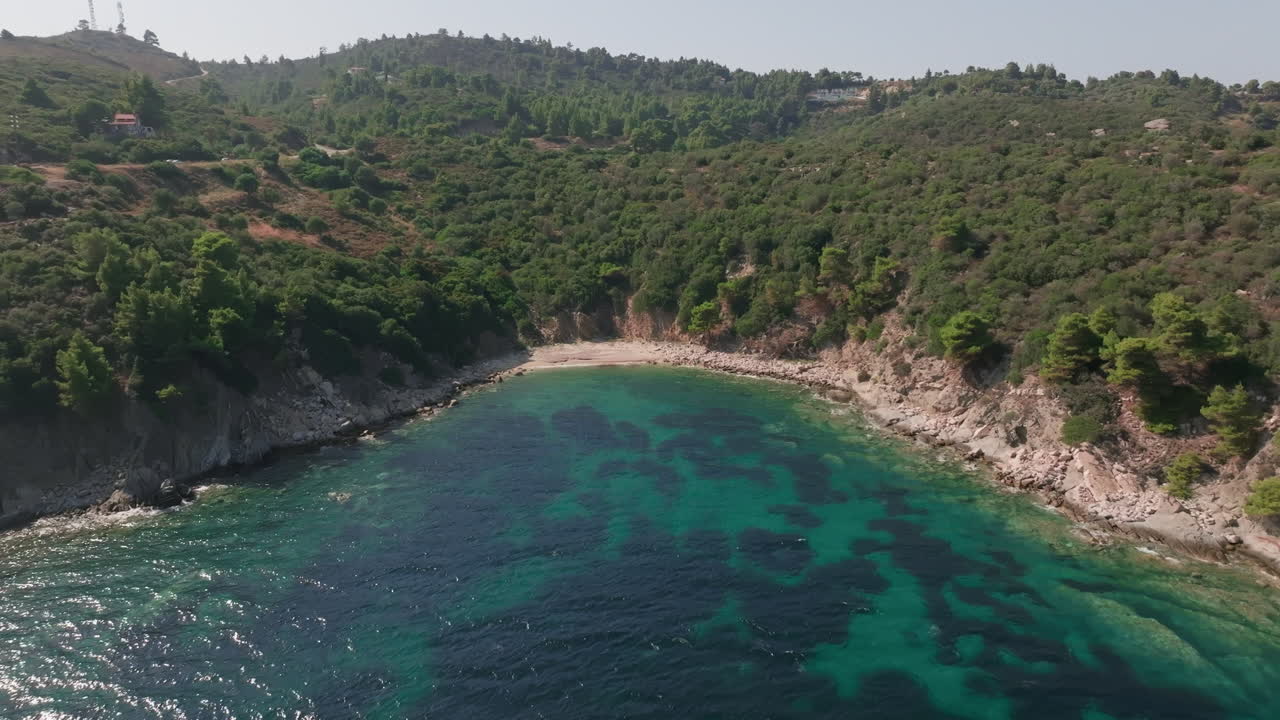 Aerial View of a Secluded Cove with Turquoise Water