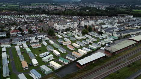 static caravan trailer beachfront staycation holiday home campground resort aerial pan left view