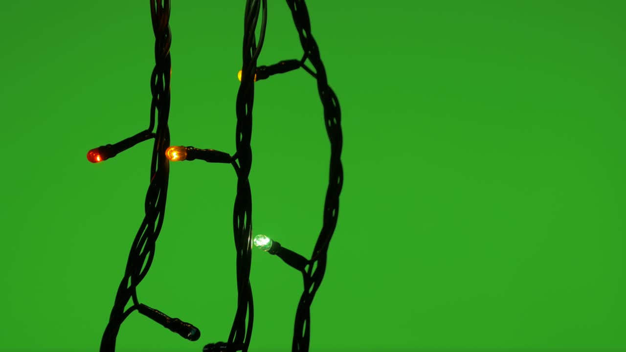 Decorative sparkling lights on green background