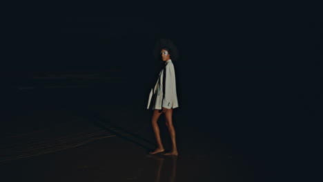 sexy girl walking sand shore at night. seductive   spinning beach