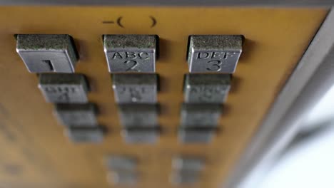 closeup of public phone buttons. over look.