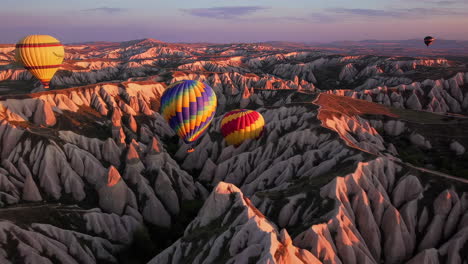 hot air balloons soaring over cappadocia at sunrise