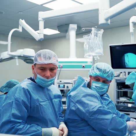 doctors concentrating on patient during surgery