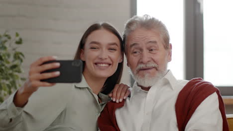 granddaughter and grandfather taking a selfie together