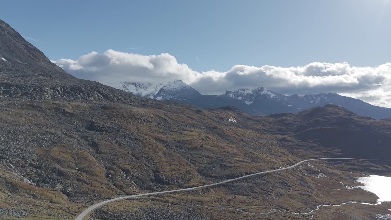 Areal footage of one of Norway's scenic routs showing beautiful landscape of Jotunheimen National Park in autumn