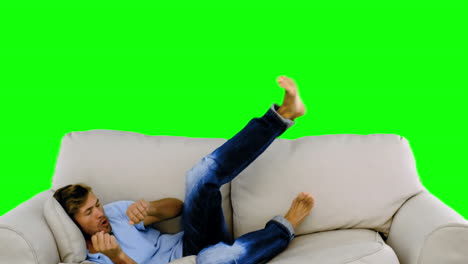 Man-jumping-on-the-sofa-on-green-screen