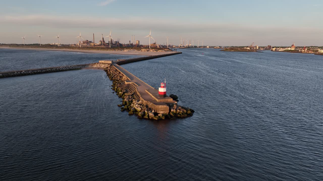 North pier Ijmuiden, small lighthouse beacon at the entrance of the North Sea canal. Aerial view.