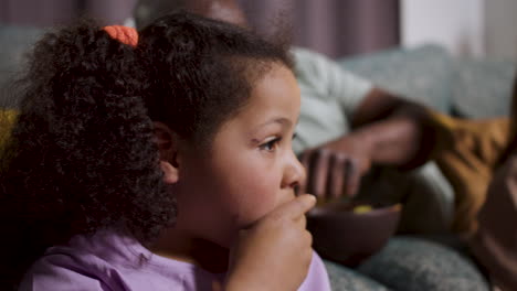 family watching film at home