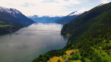 drone flying over a farm near the hardangerfjord