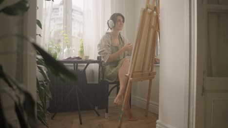 woman painting at home