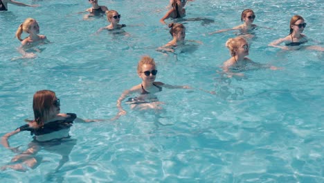 girls are engaged in aqua aerobics