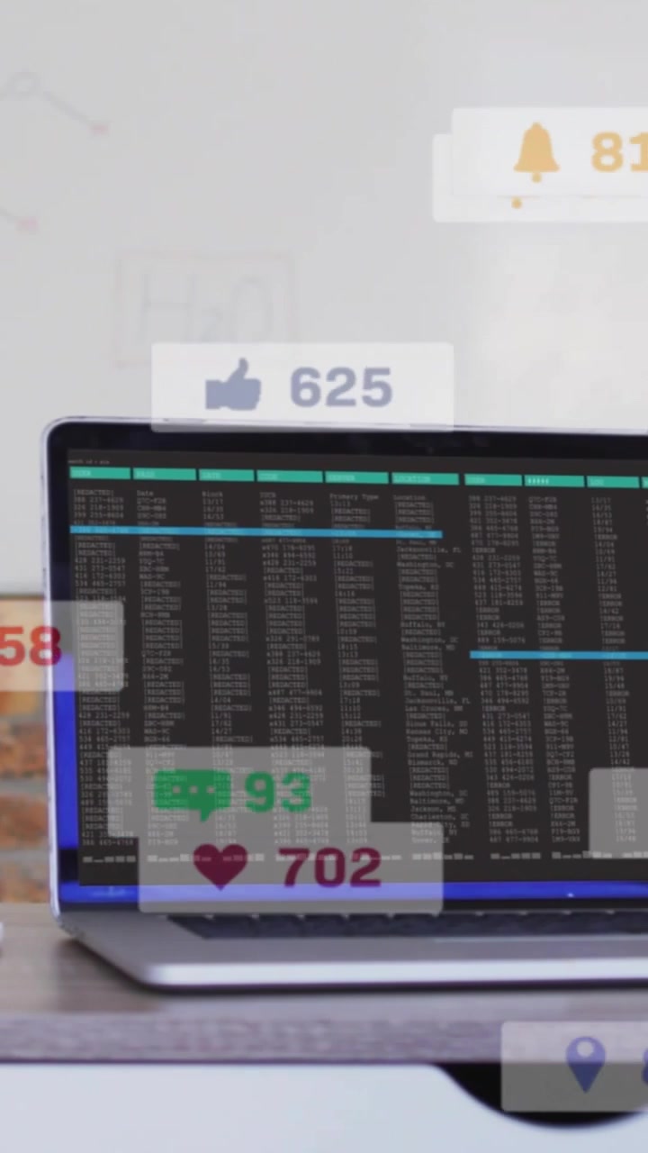 Vertical video: System pinging badges floating over laptop screen showing counts and progress