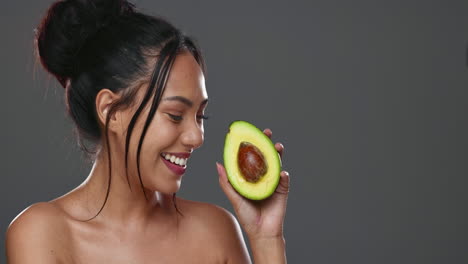 Woman,-avocado-and-beauty-in-studio-for-health