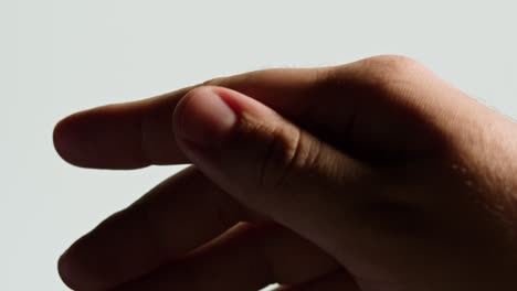 Close-up of a hand with two fingers slightly apart