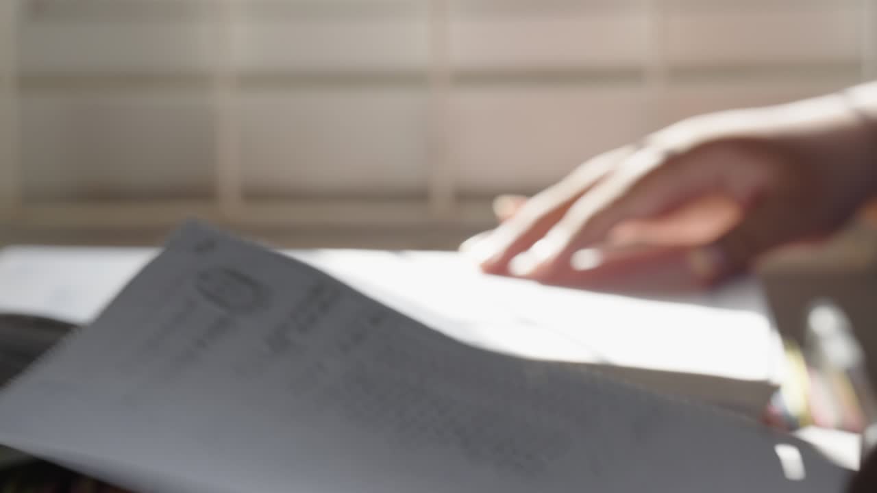 Female staff searching for documents in the office filing cabinet