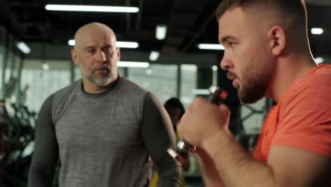 young boxer working out with coach