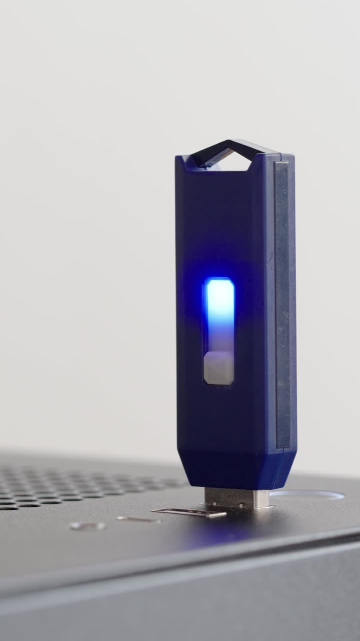 Man plugging and unplugging a USB flash drive. Computer. Close up