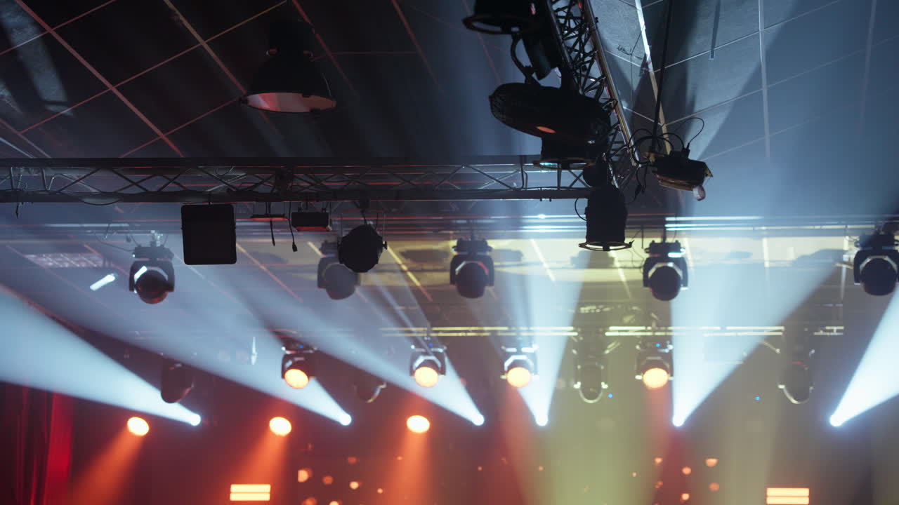 Dynamic Stage Lights Moving and Changing Colors in a Concert Venue