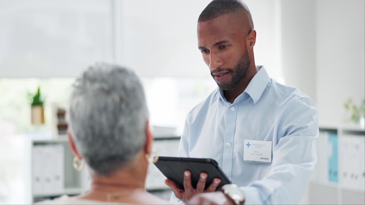 Doctor Consults with Elderly Patient