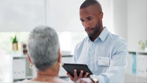 doctor consults with elderly patient