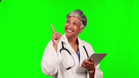 Doctor,-pointing-and-tablet-on-green-screen