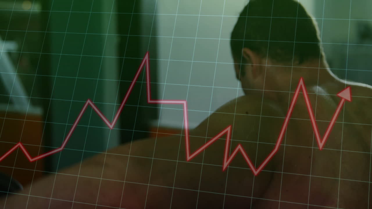 Soggetto maschile sdraiato prono all'interno, che mostra un grafico rosso e una sovrapposizione a griglia che illustrano dati sulla salute.