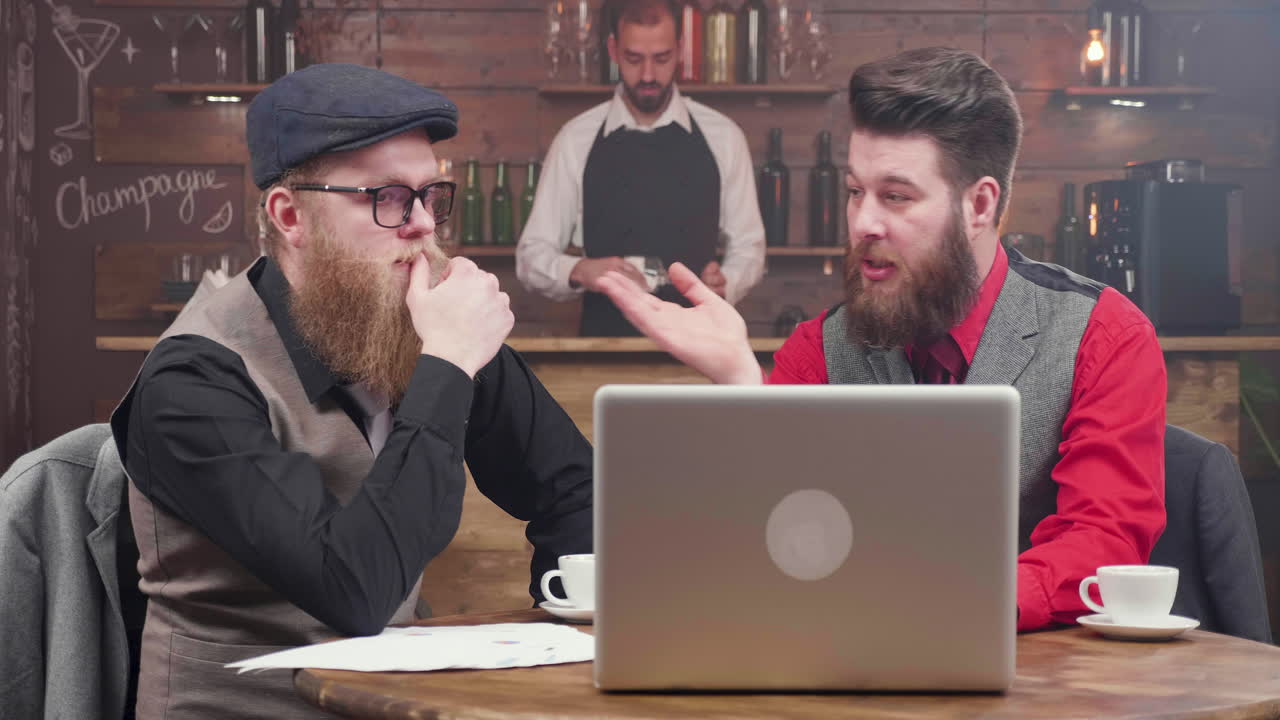 Men working at a bar