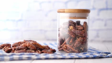 sweetened pecans in a glass jar