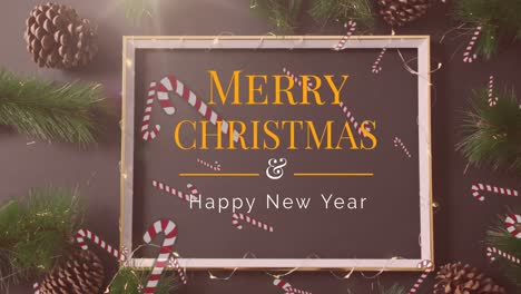 Animation-of-merry-christmas-and-happy-new-year-text-in-frame-over-decorations-on-brown-background