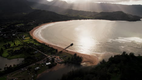 Drone-shot-of-a-pier-at-sunset-at-Kauai,-Hawaii