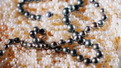 natural pearls are white and black. background of jewelry