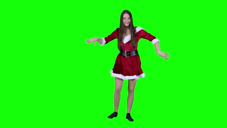 Caucasian-female-Santa-cosplay-dancer-performing-in-front-of-the-green-screen-wearing-a-dress