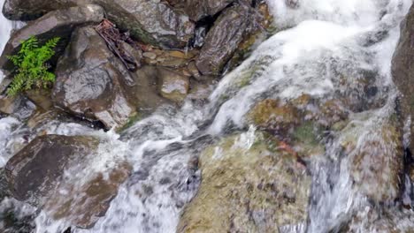 Water-stream-on-stone.-Small-water-fall-on-rock.-Water-flowing-between-stones
