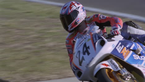 a motorcyclist makes a turn on a track