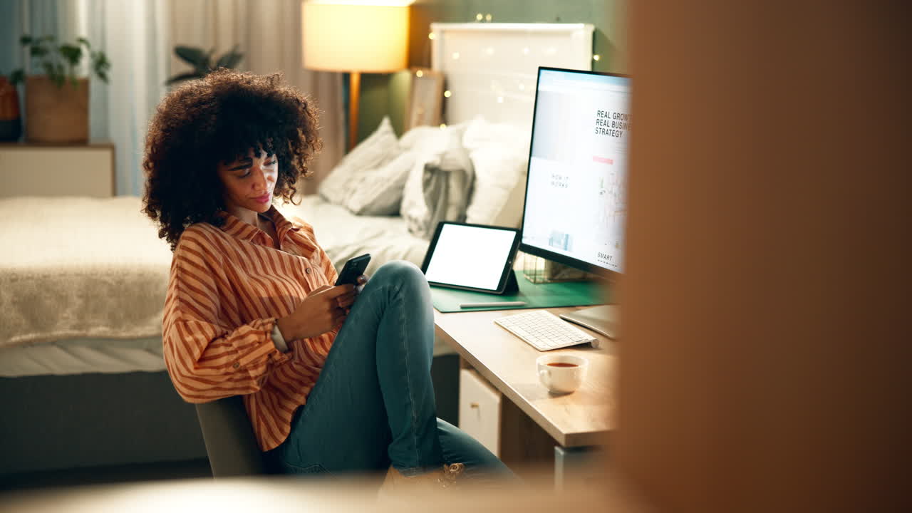 Woman working from home on her phone and tablet