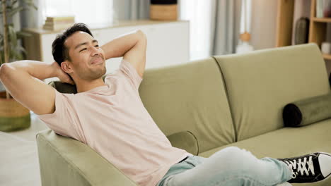 man relaxing on a sofa