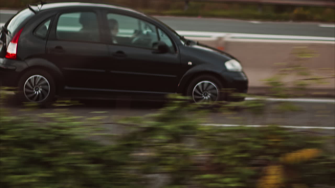 Nice, France - November 24, 2024: View from a moving train of cars moving on the streets of the city