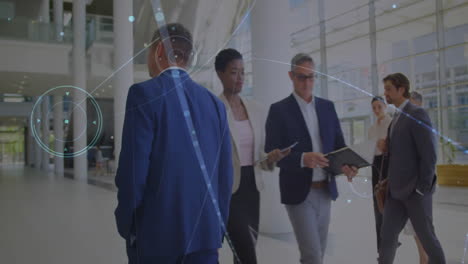 animation of connections over diverse business people walking in office