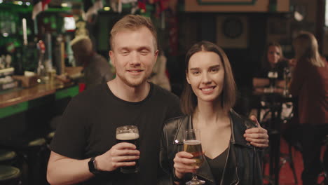 happy young couple at bar