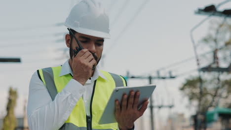engineer communicating at a powerline site