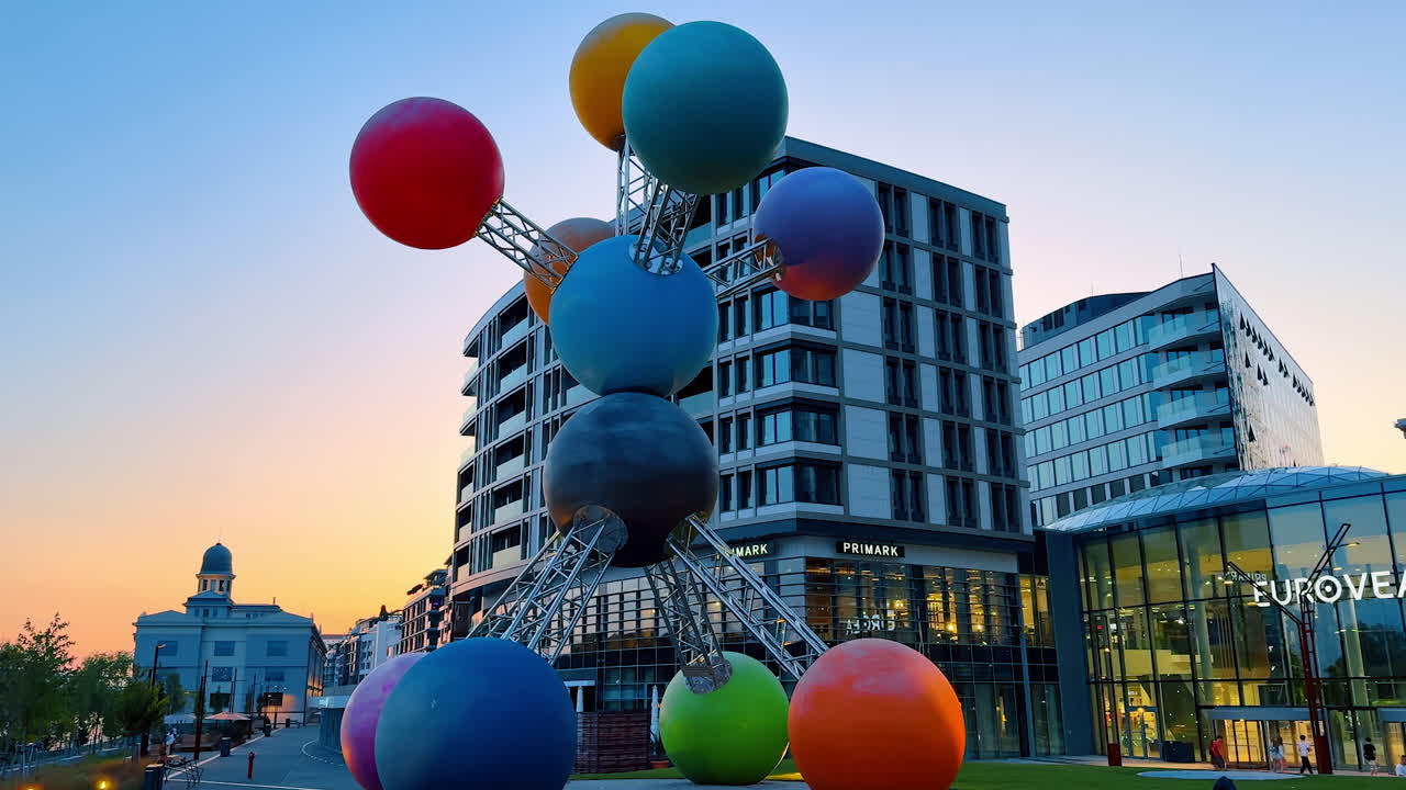 Bratislava, Slovakia, 2 June 2025: Bratislava sunset sculpture. A unique sculpture composed of colorful spheres stands in Bratislava against a sunset backdrop, attracting attention