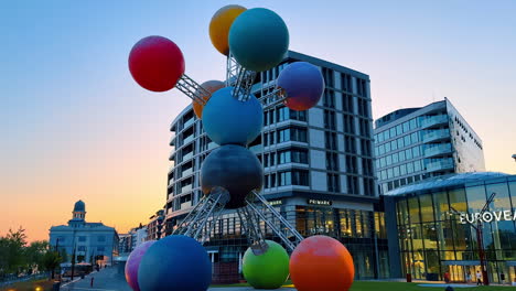bratislava, slovakia, 2 june 2025: bratislava sunset sculpture. a unique sculpture composed of colorful spheres stands in bratislava against a sunset backdrop, attracting attention