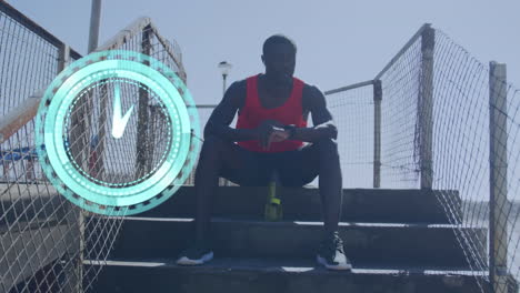 animation of clock over an african american man sitting on the stairs