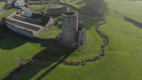 aerial shot revolving around an old castle in tretower wales