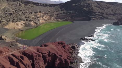 lanzarote canary island aerial footage of lonely black sand beach in parque natural de los volcanes